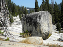 Huge boulder on the smaller big granite slope