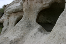 Holes were created by volcanic gas bubbles plus weathering
