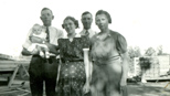 Bob (holding Dick), Hazel, Frank & Mabel Estel, late 1939, Merrill's lumber yard in Bootjack