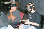 FCUG member Ed Hart (left) and another attendee try out the 3-D goggles for the Vectrex