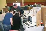 Larry Anderson (in black) shows off his PET exhibit