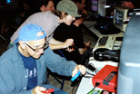 (foreground) Jerold on the Famicon, (background) Rory on the VIC 
