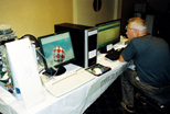 Gene testing MorphOS (background) while the SAM has AmigaOS 4.1