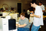 Duncan MacDougall (seated) shows off the X68000 computer
