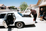 Larry and Al Jackson load equipment into Robert's car