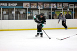 Captain Jacob Haynes sweeps the puck away from an opponent's stick