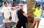 Mikie tests his pitching speed at a Fresno Grizzlies game