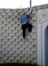 Johnny could not resist this de facto climbing wall